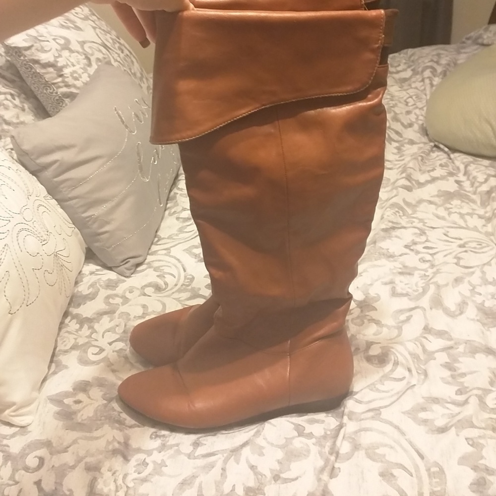 Tall brown boots.